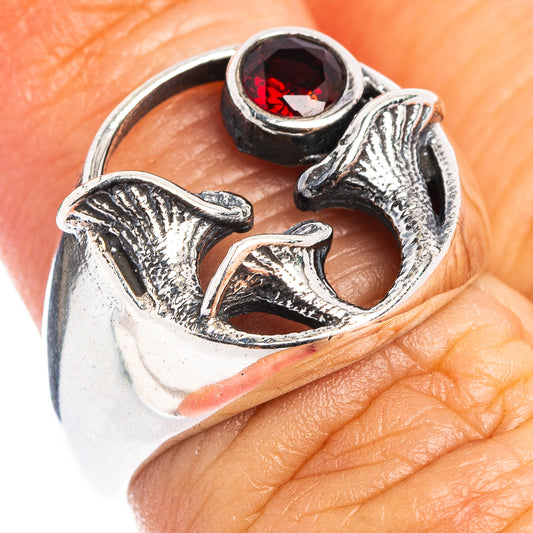 Sterling silver mushroom ring with red garnet stone, ring on finger view