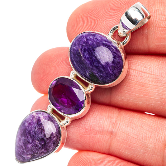 Sterling silver pendant with oval charoite and faceted amethyst in bezel setting