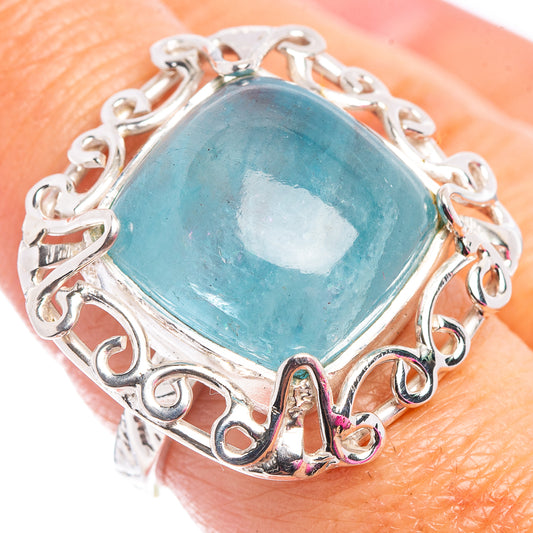 Sterling silver aquamarine ring with oval blue gemstone and small gemstone accents