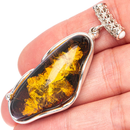 925 sterling silver oval pendant with Baltic amber cabochon and silver bail