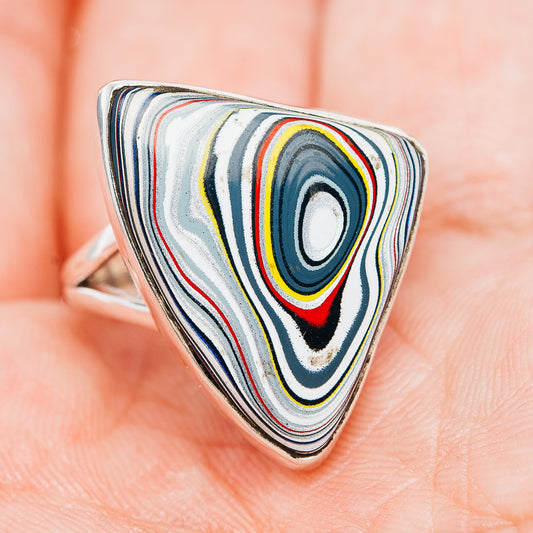 Triangular ring with layered swirl stripes in blue, white, red and yellow; .925 silver band