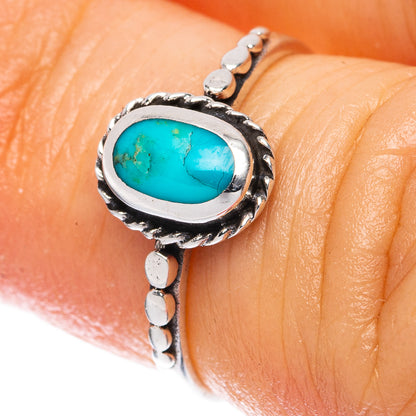 Oval turquoise cabochon sterling silver ring with ornate bezel and dot details
