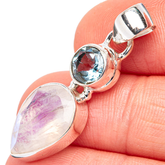Sterling silver pendant with round blue gemstone and oval iridescent moonstone, linked bezel