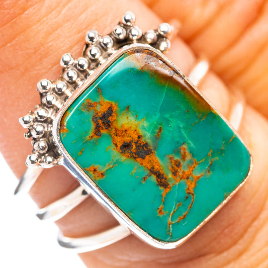 Turquoise gemstone ring in .925 sterling silver, oval stone with silver crown detail.