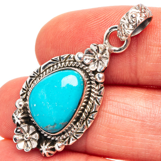 Turquoise teardrop pendant, .925 sterling silver with ornate floral frame and loop bail