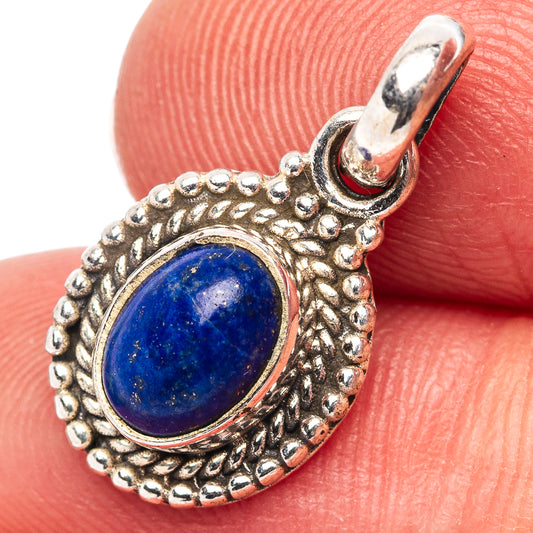 Oval lapis lazuli pendant in .925 sterling silver, beadwork bezel and rounded bail.