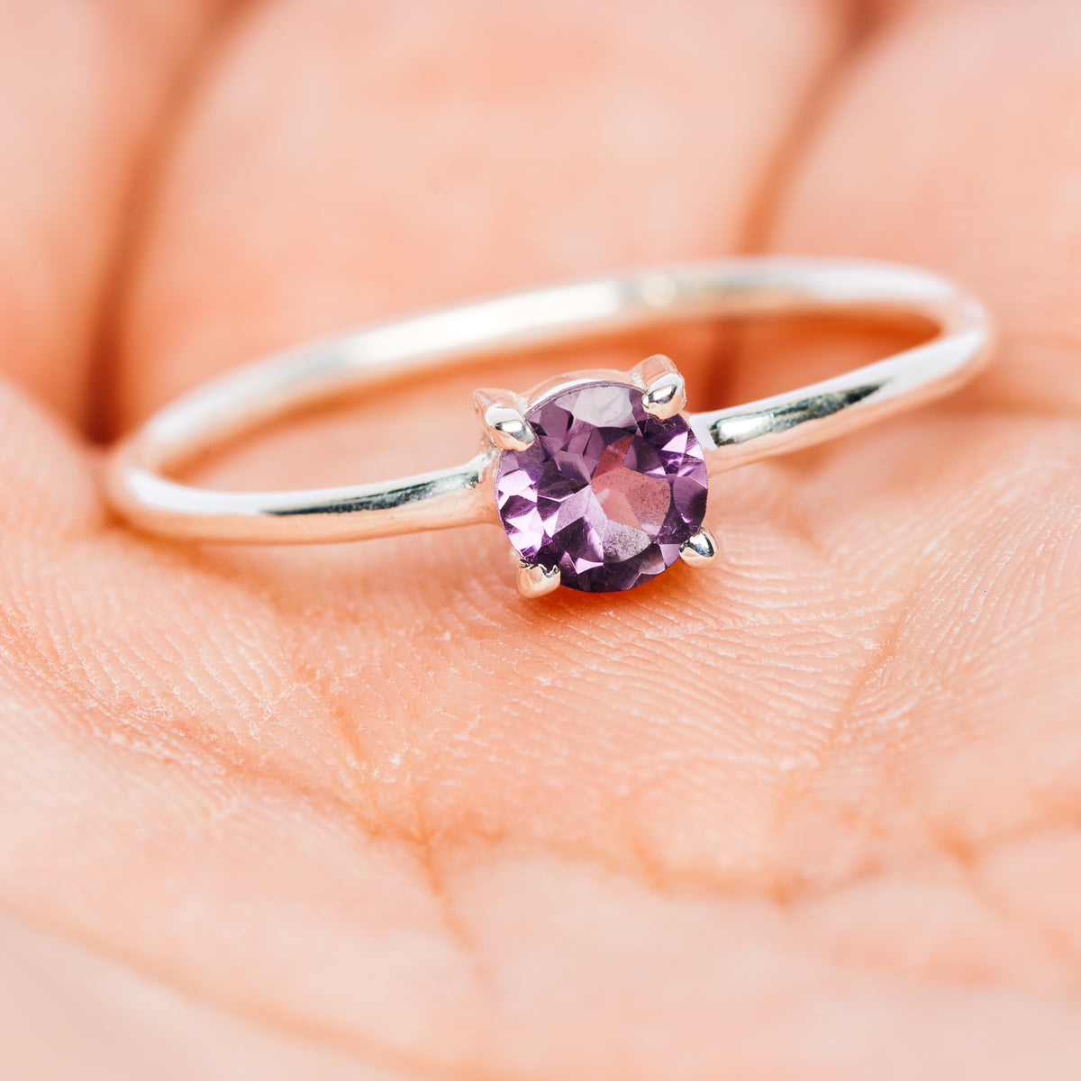 Amethyst stackable sterling silver ring, round purple center stone, side view