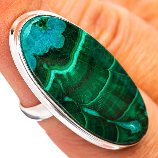 Oval green malachite gemstone ring in .925 sterling silver, size 6, on finger