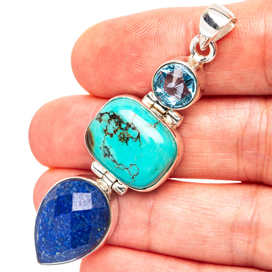 Sterling silver pendant with turquoise oval, lapis teardrop, and blue topaz round stone
