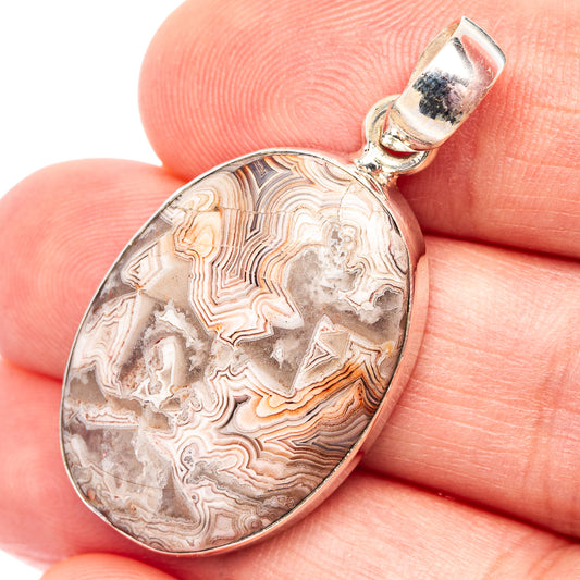Sterling silver lace agate pendant with teardrop bezel, marbled gray and tan stone.