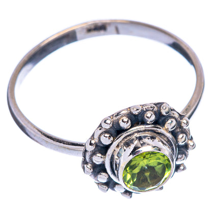 Sterling silver dainty ring with round green peridot, scalloped setting, size 6.5