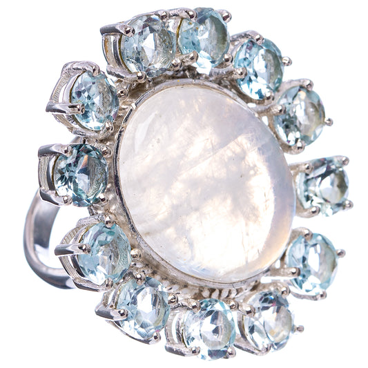 Silver moonstone ring with oval center and blue topaz-like stones, full view