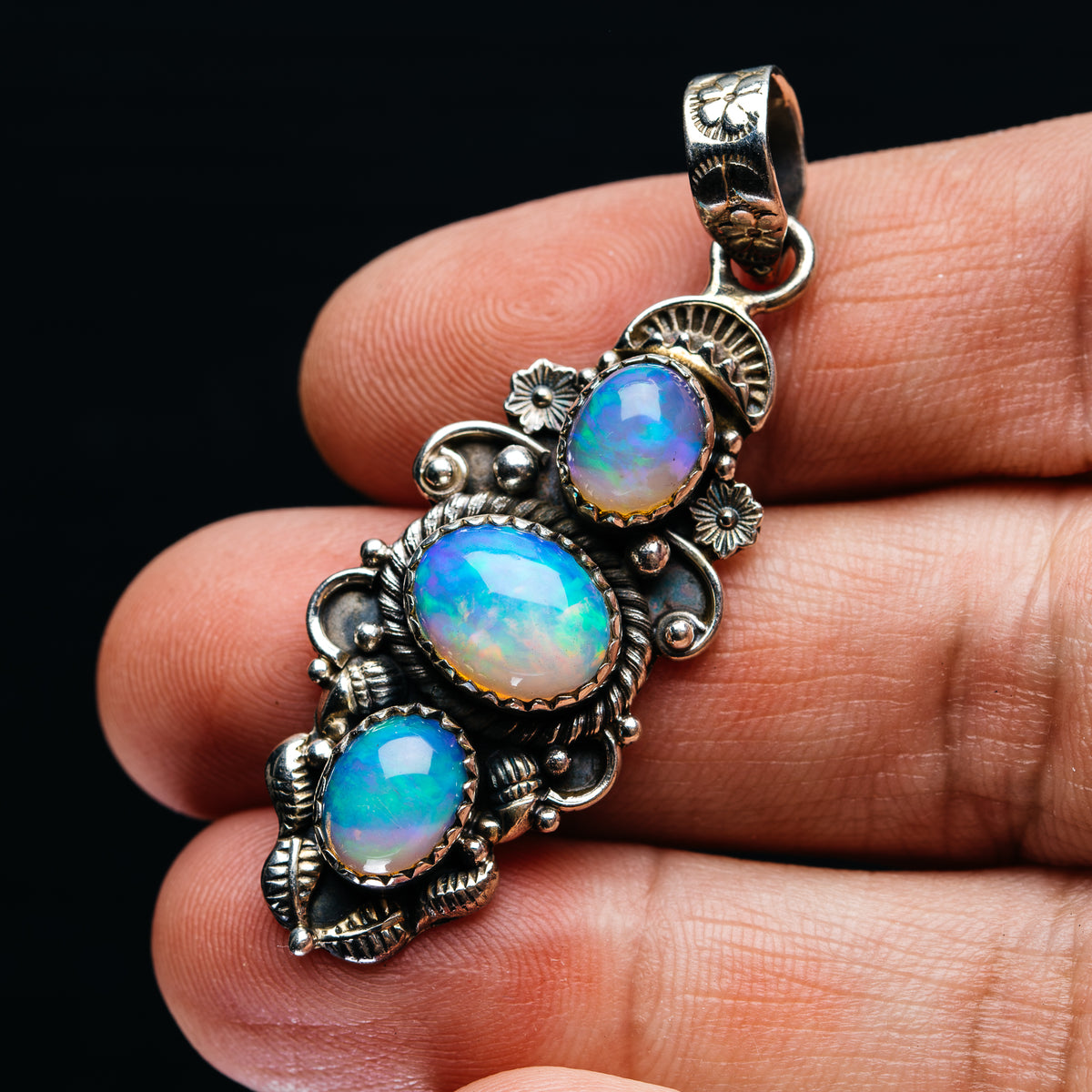 Three-opal pendant in .925 sterling silver with blue opal cabochons