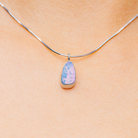 Sterling silver necklace with teardrop blue opal pendant on thin cable chain