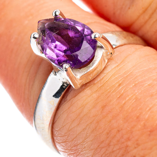 Sterling silver amethyst ring with faceted oval purple gemstone in prong setting