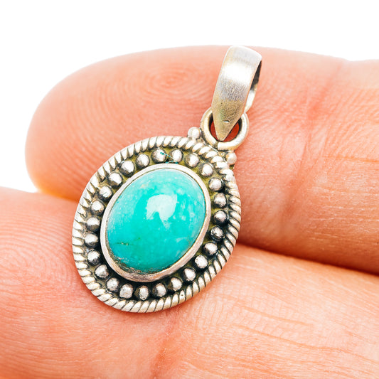 Turquoise cabochon pendant in sterling silver oval with beaded border and loop bail