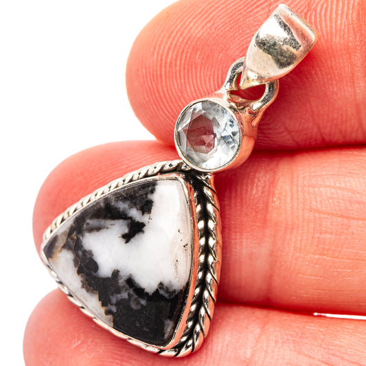Sterling silver pendant: round blue gemstone with buffalo-white/black stone drop