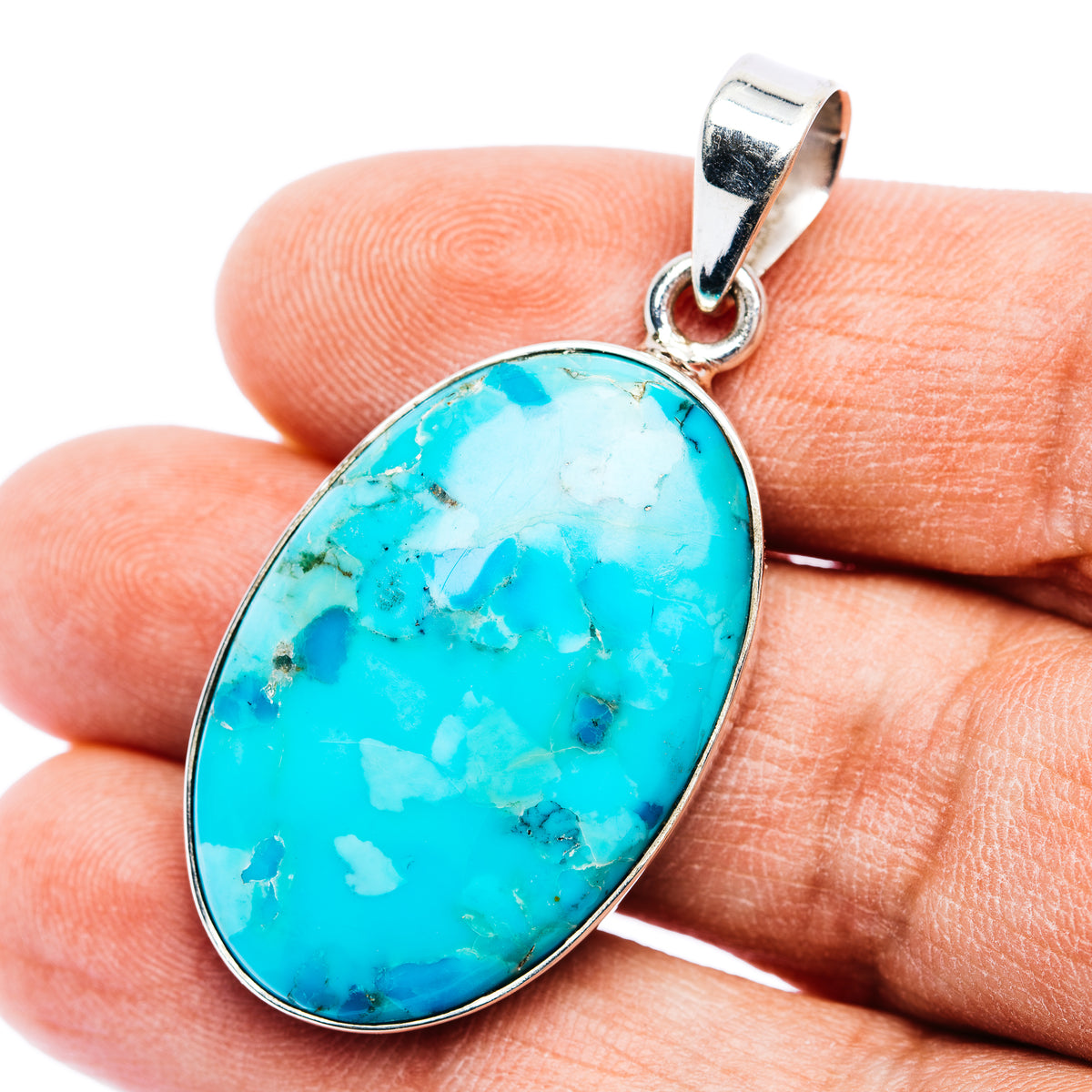 Oval turquoise cabochon pendant in .925 sterling silver with loop bail