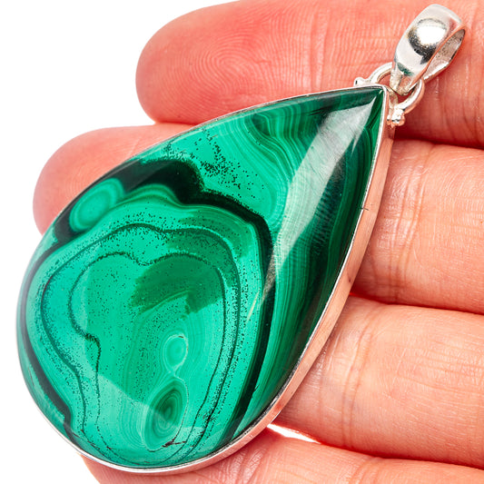 Green malachite teardrop pendant on .925 sterling silver setting, close-up from side