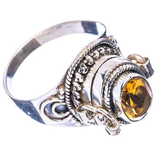 Sterling silver ring with oval yellow gemstone and ornate filigree setting