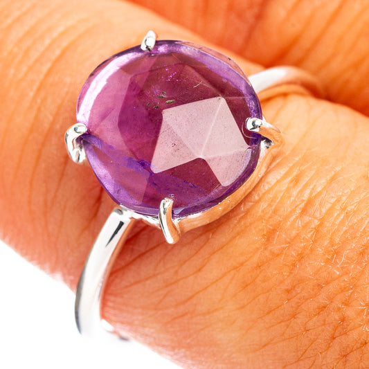 Amethyst faceted oval ring with prong-set purple gemstone on sterling silver band
