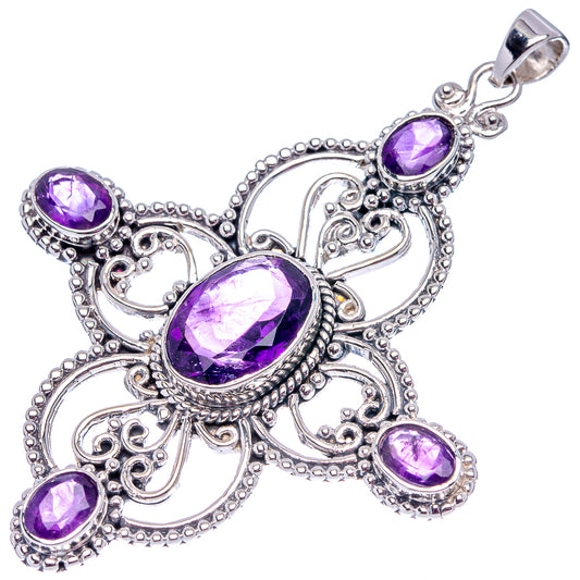 Signature amethyst cross pendant with three purple oval stones and ornate silverwork