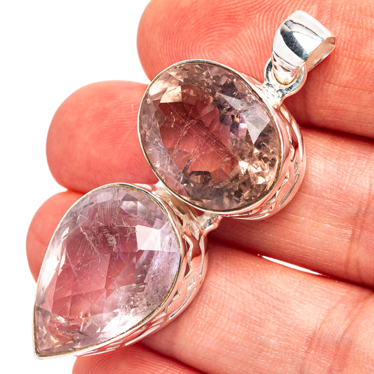 Teardrop amethyst pendant in polished sterling silver with faceted stones and bail