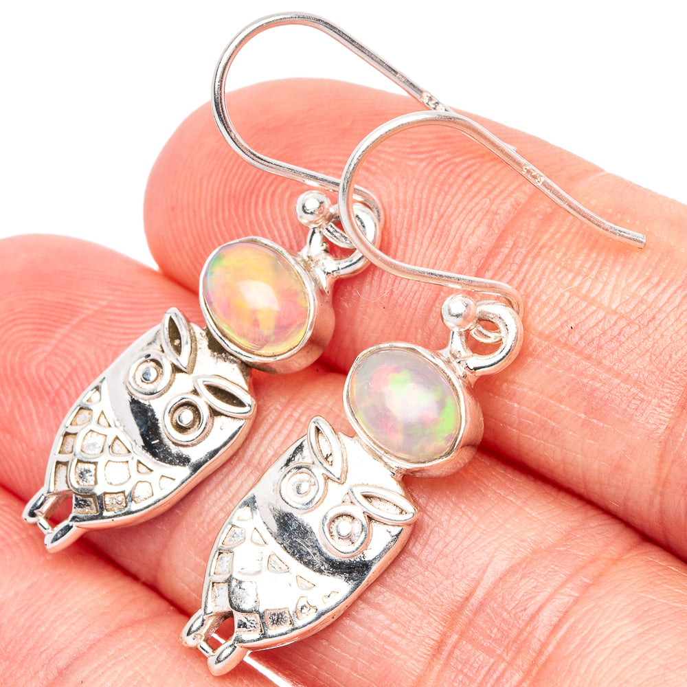 Silver owl earrings with round iridescent opal cabochons and fishhook backs