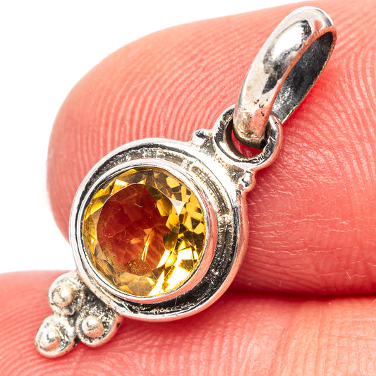 Sterling silver citrine pendant with round yellow gemstone and decorative bail