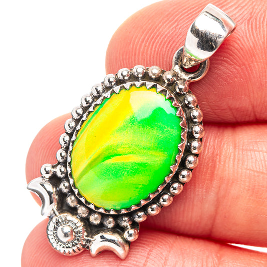 Sterling silver opal pendant with oval green-and-yellow cabochon, scalloped bezel