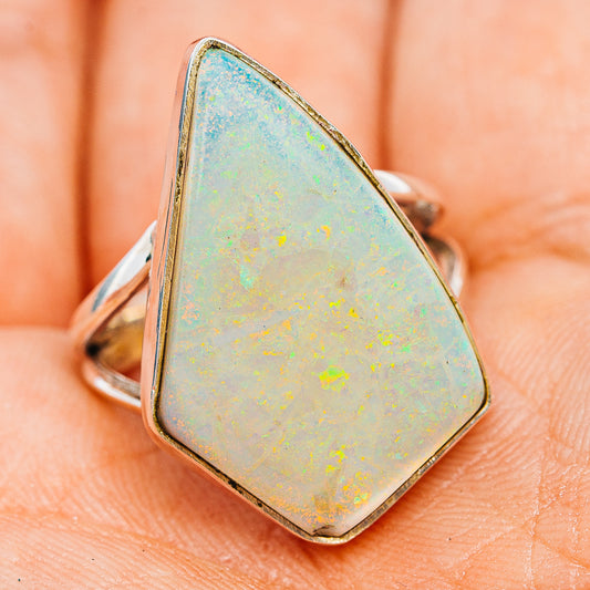 Sterling silver opal ring with teardrop opal face and slim band, side angle