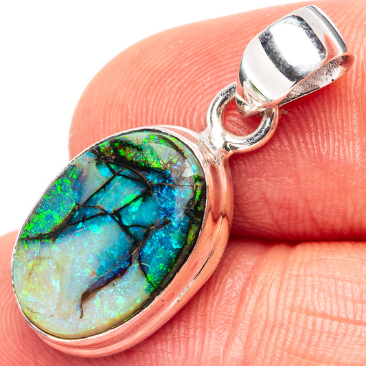 Sterling silver opal pendant with oval bezel, green-blue iridescent stone and loop bail