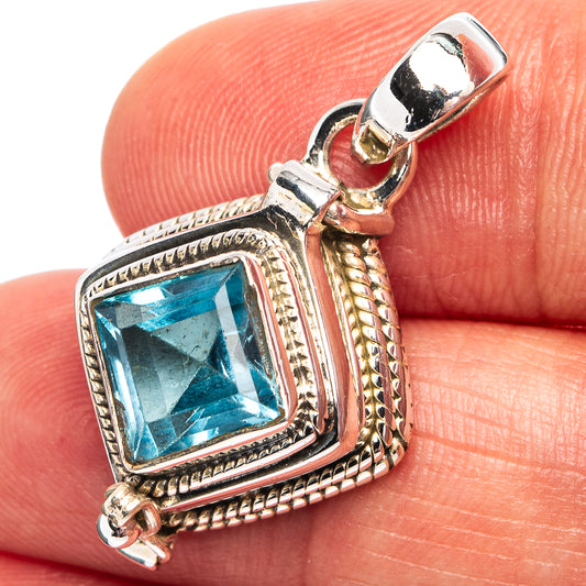 Sterling silver pendant with square blue gemstone, ornate bezel and rope frame