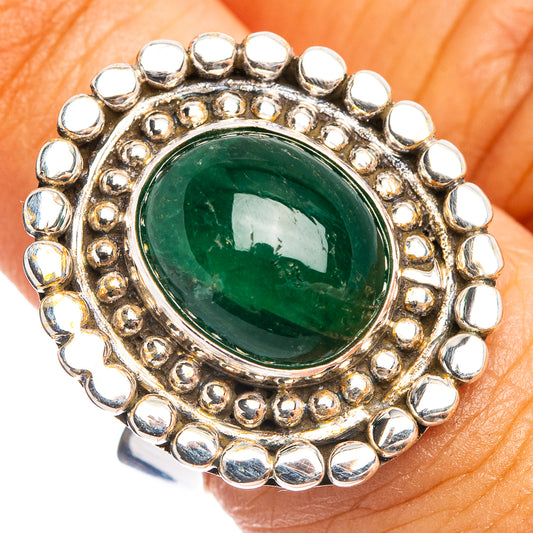 Adjustable sterling silver ring with round green gemstone and bead halo bezel