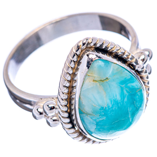 Sterling silver ring with turquoise-blue oval gemstone, rope bezel and scrollwork