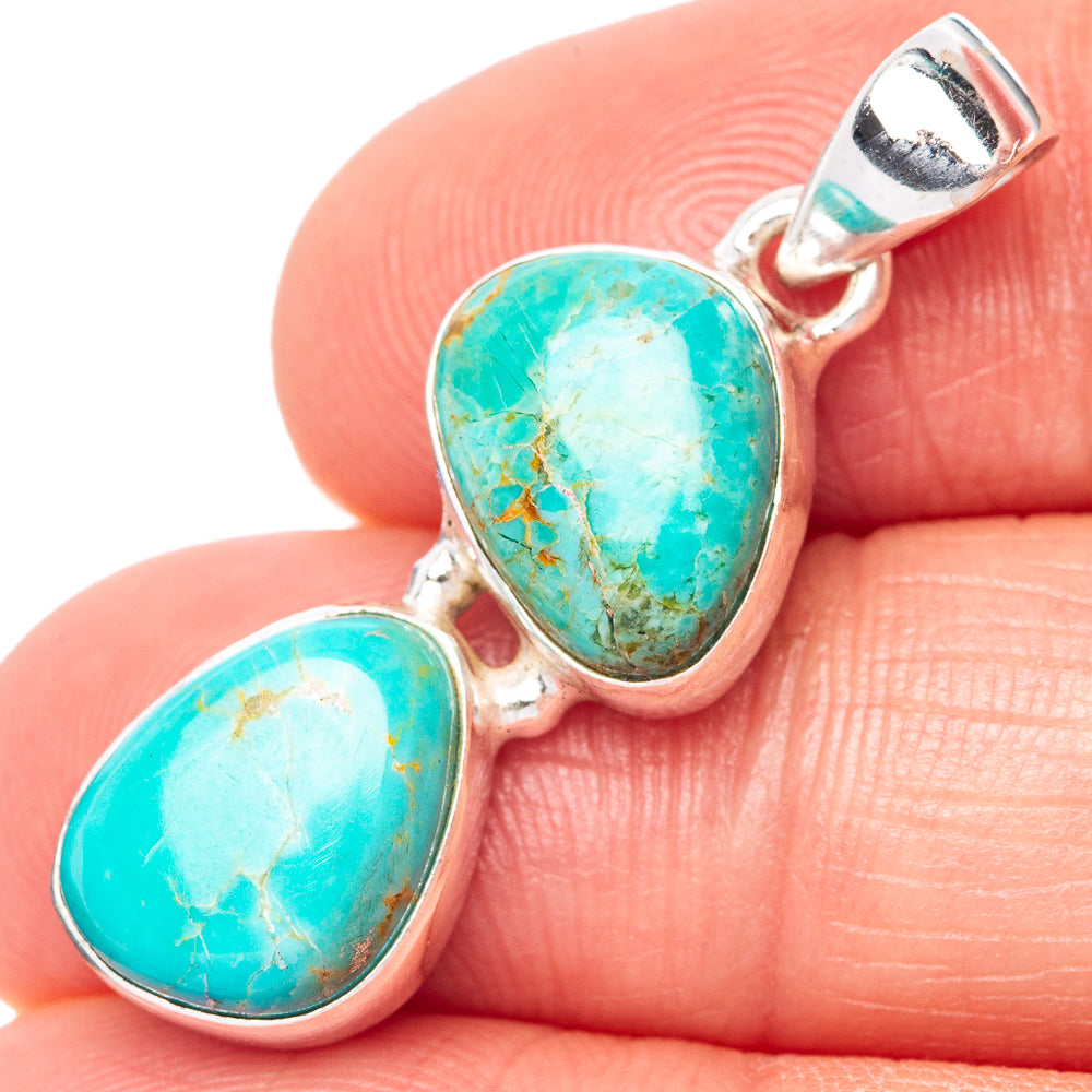 Turquoise cabochon pendant in 925 silver with oval stone and top bail