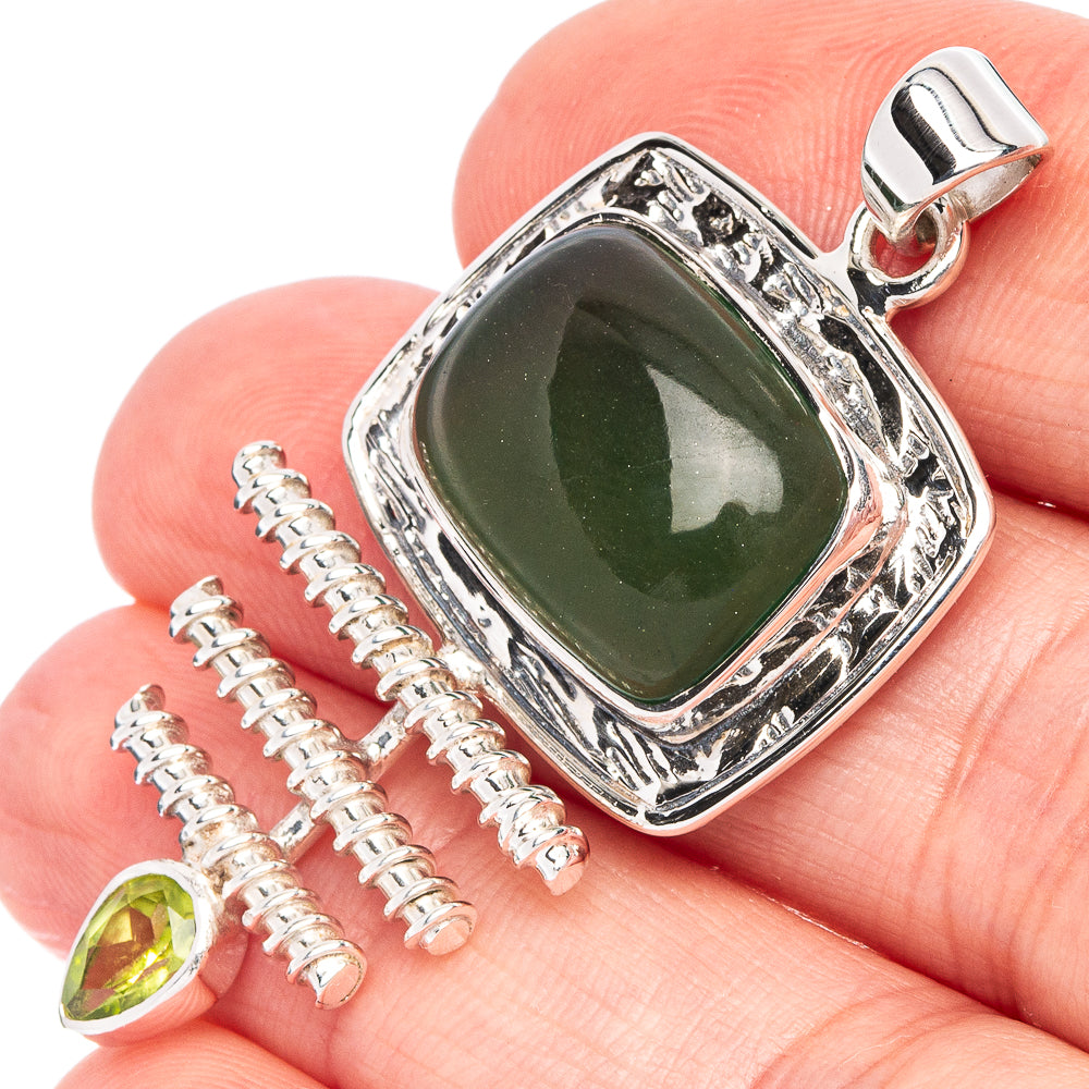 Sterling silver pendant with green nephrite jade cabochon and peridot drop accents
