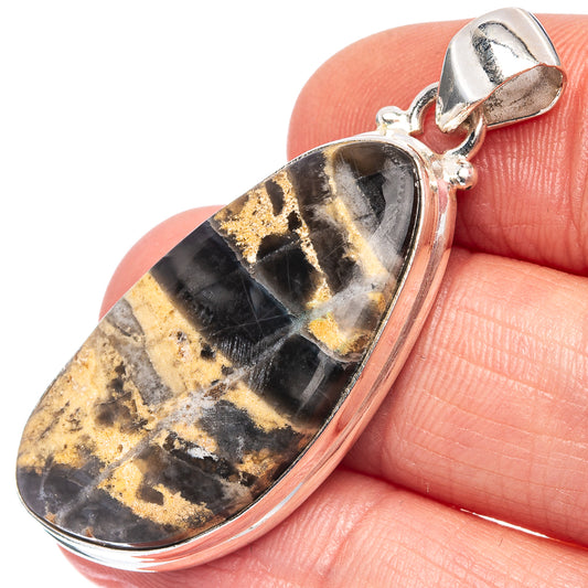 Dendritic agate pendant in oval silver bezel with hinged bail