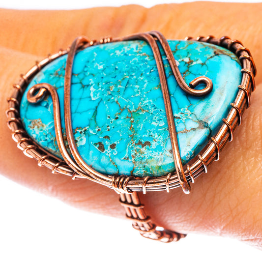 Turquoise oval cabochon copper ring with curved wire prongs and twisted bezel