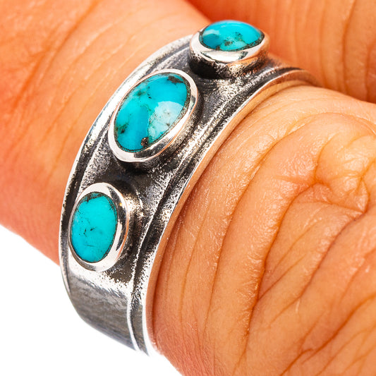 Sterling silver ring with three oval turquoise cabochons on a scalloped band