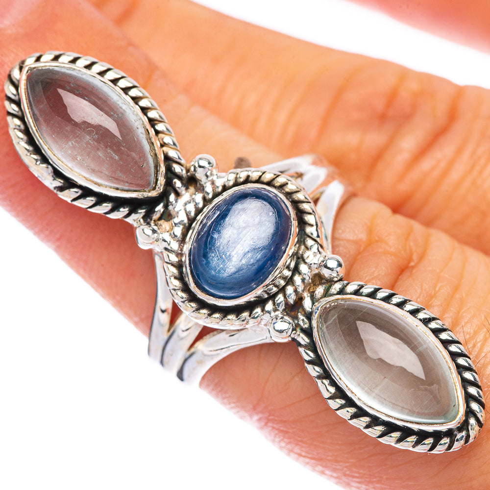 Sterling silver oval kyanite ring with blue center stone and two dark oval accents
