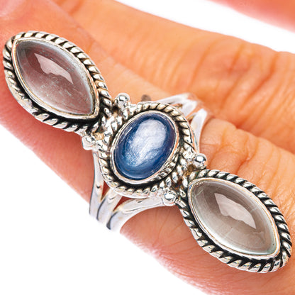 Sterling silver oval kyanite ring with blue center stone and two dark oval accents