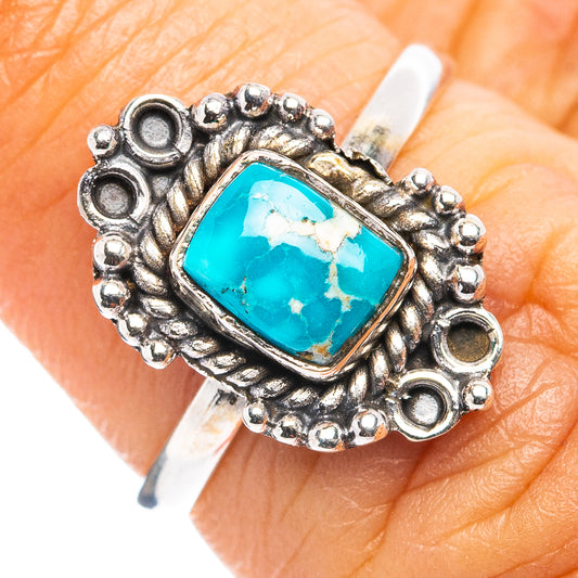 Sterling silver ring with square turquoise cabochon and ornate raised bead border