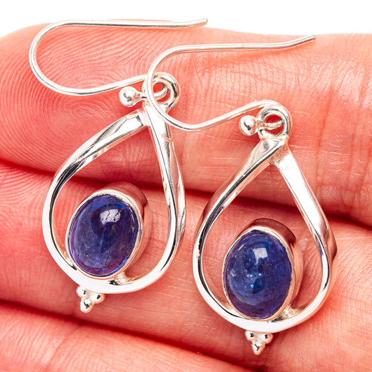 Sterling silver teardrop earrings with blue oval gemstone in bezel