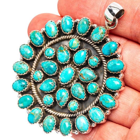 Round turquoise pendant with sterling silver rope bezel and small loop bail.