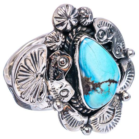 Ornate silver ring with blue turquoise teardrop cabochon and engraved side accents