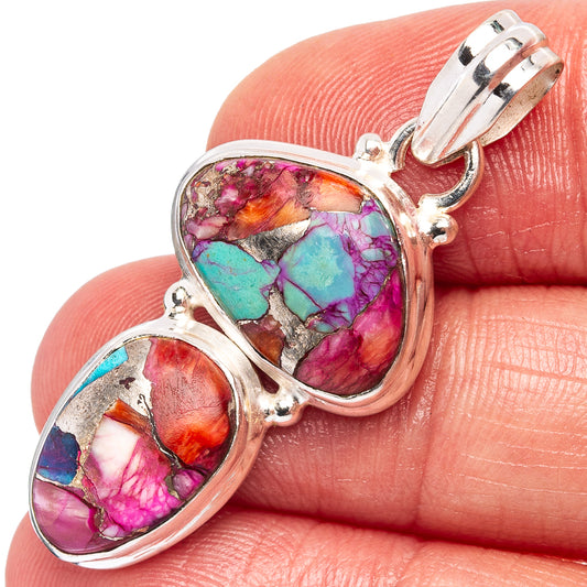 Sterling silver double-oval pendant with pink–magenta and turquoise stone inlays