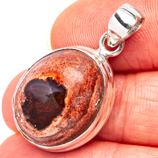 Sterling silver fire opal pendant with oval orange-red stone and round silver bezel
