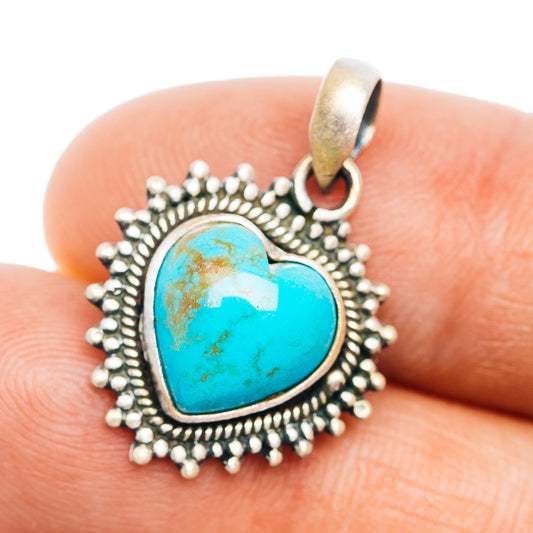 Turquoise heart pendant with ornate sterling silver bezel and loop bail