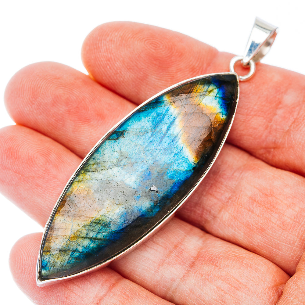 Sterling silver pendant with marquise iridescent blue-brown stone and bail